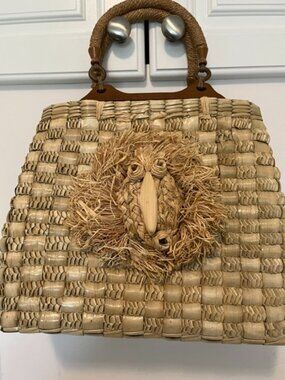 Vintage woven basket w raffia bird decal.